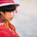 Peru, Ollantaytambo, Young Quechua boy in traditional clothing and hat